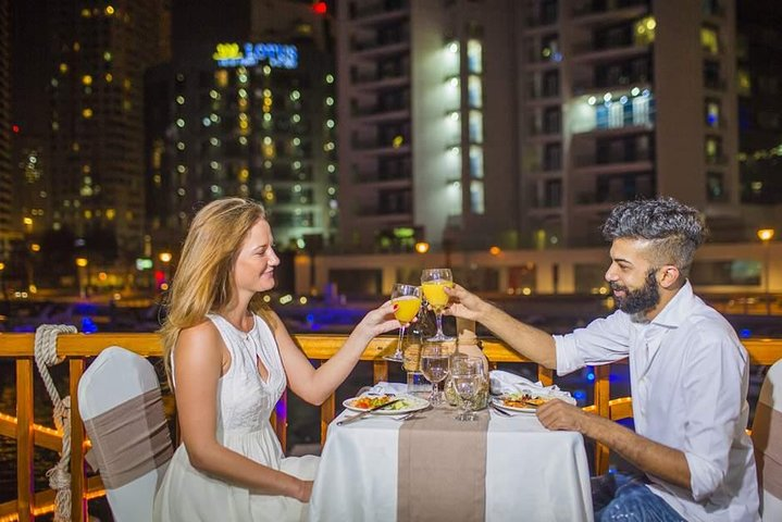 Experience a delightful evening on Dubai Canal with a scenic cruise savoring a gourmet buffet dinner and enjoying the stunning city skyline as you toast to unforgettable moments.